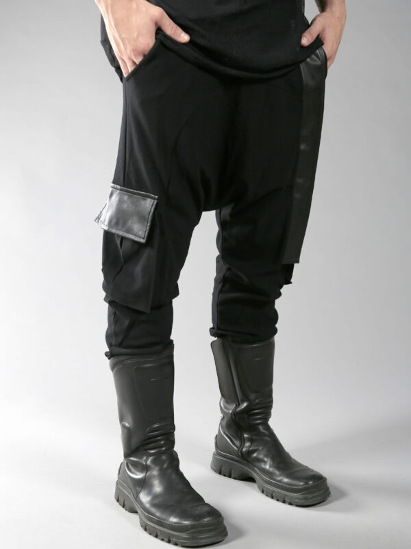 Black long loose pants for men designed with eco-leather and 2 pockets on the side