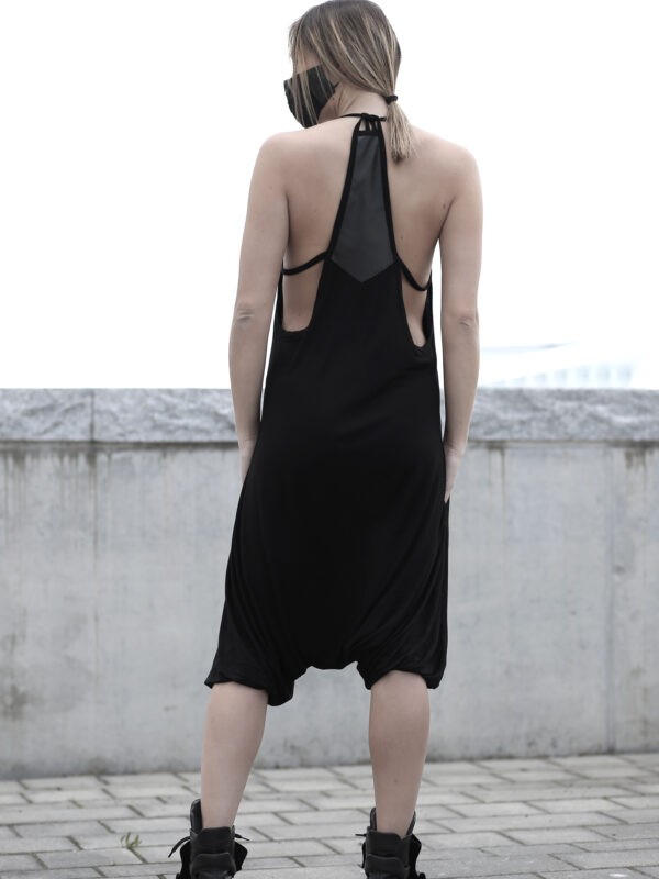 Black viscose jumpsuit designed with vegan leather with pockets. A loose jumpsuit for women in love with dark fashion and alternative fashion style.